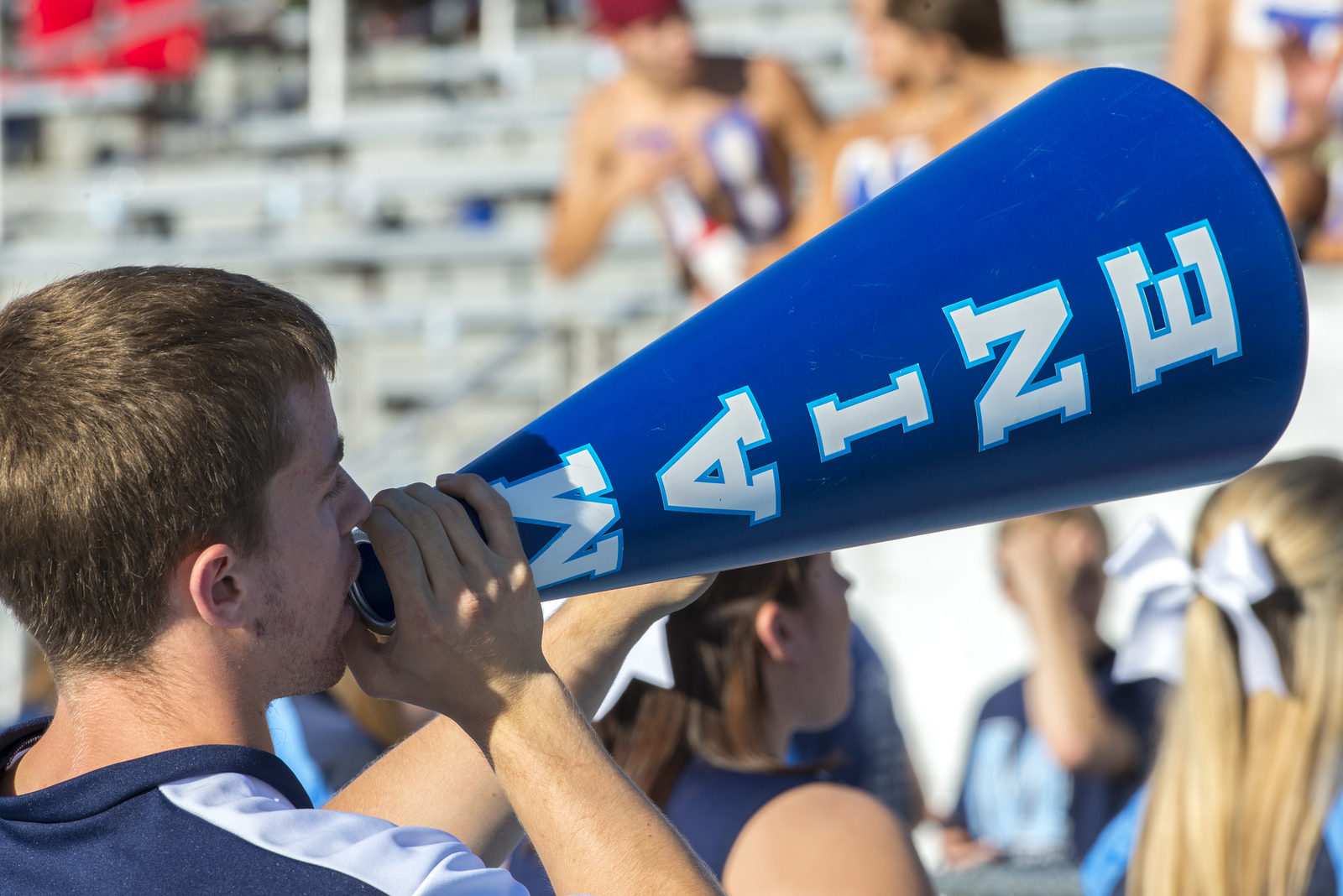 Cheering student at football game